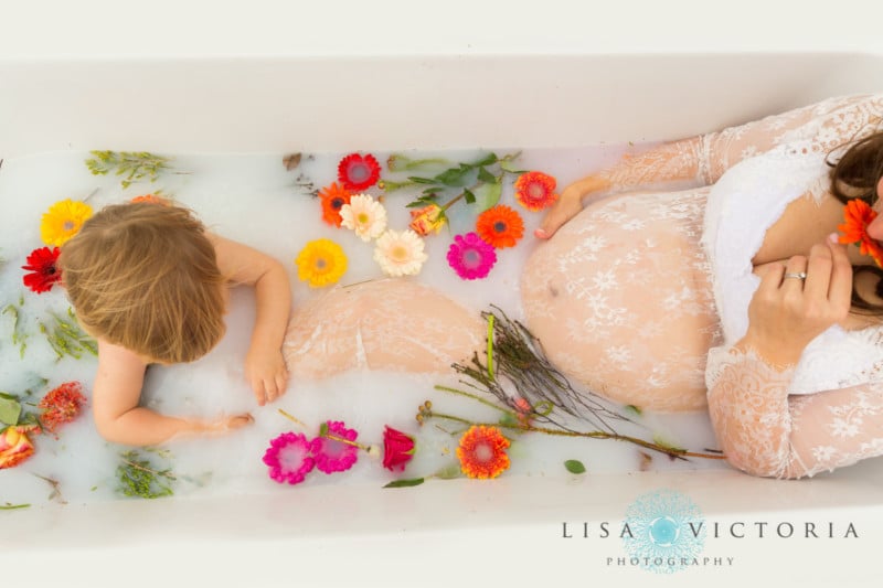 A milk bath photo shoot with a pregnant mother and her son